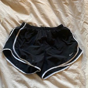 Nike Dri-Fit white striped shorts.